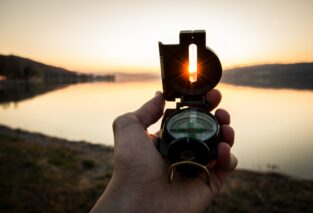 Person holding compass